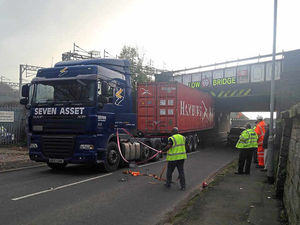 Supporting image for story: Lorry wedged beneath railway bridge in crash