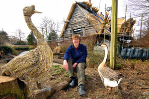 Seeing double  Sally Barnett outside her cottage with Jack and his straw friend