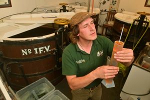 Black Country Ales assistant brewer Anthony Stokes checks the strength of the brew