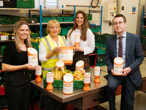 Supporting image for story: Car dealer helps rev up food charity's fundraising with collection tin donation