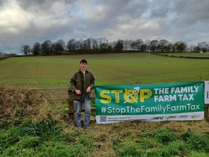 Oliver Garratt  with a banner 