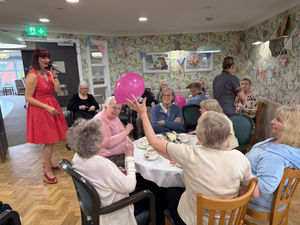 Residents at HC-One’s Littleton Lodge Care Home enjoying Afternoon Tea event for Breast Cancer Now charity