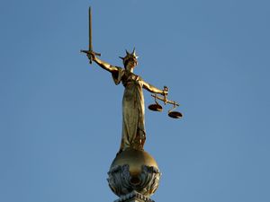 The Statue of Justice atop the Central Criminal Court building, Old Bailey, London