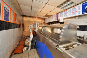 The crash destroyed the frontage and caused significant damage inside the shop