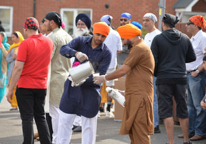 The Vaisakhi parade taking place in Wolverhampton, starting from the Guru Nanak Sikh Gurdwara