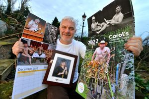 David Bryant with some of the nude calendar photos