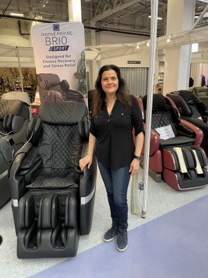  Nina Wadia standing beside the Furniture for Life massage chair 