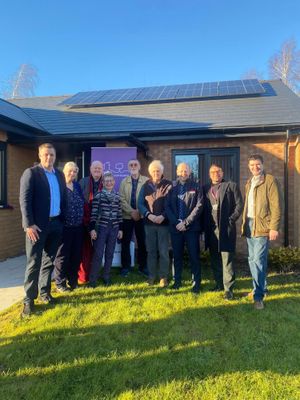 Local stakeholders celebrate the completion of affordable housing development