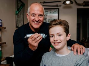 Supporting image for story: Steve Bull shaves young Wolves fan's hair for charity