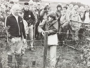 Hawkley Farm, Pensax, near Bewdley: Ramblers cut through barbed wire and ripped down illegal fencing to exercise their rights to walk on a public footpath crossing the land, after farmer Gerald Kincaid had blocked the path and threatened ramblers. The photograph shows Edgar Powell of the Hereford-Worcester branch of the Ramblers' Association and Kate Ashbrook cutting barbed wire on September 18, 1988.