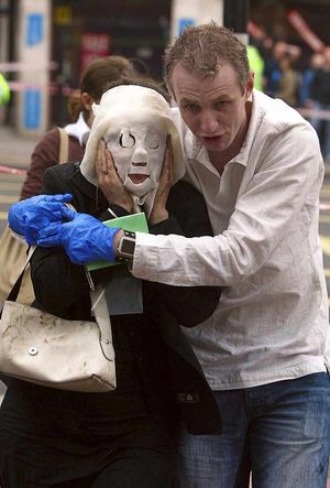 Injured tube passengers are escorted away