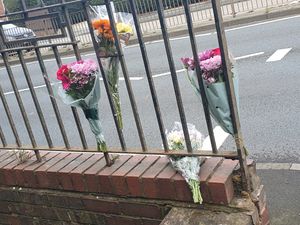 Supporting image for story: Tributes left on Dudley road where woman in 20s killed in suspected hit-and-run
