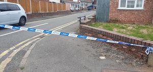 The road was cordoned off at both ends hours after the stabbing