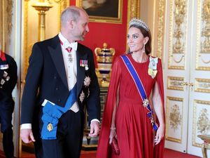 Supporting image for story: Kate dazzles in dark red silk at state banquet return