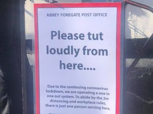 Supporting image for story: 'Please tut loudly from here': Impatient queuers delivered cheeky signs by Shrewsbury post office