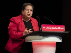 Dame Jackie Baillie speaking from a Scottish Labour lectern