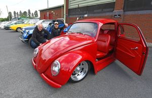 Guy Nicholls and Lee Rudkin pose next to their 1958 beetle