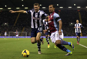 Gareth McAuley and Aston Villa's Gabriel Agbonlahor battle for the ball 