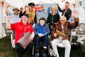 Charles with care home staff, family and Paula Covacs and Steve Haines from RAF Museum Midlands
