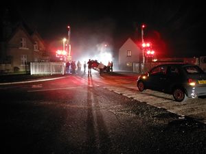 Supporting image for story: Woman rescued after overturned car blocks Shropshire level crossing