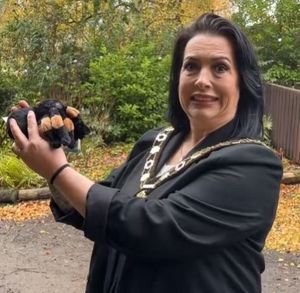 Councillor Callear warms up with a toy spider. Image: Telford & Wrekin Council