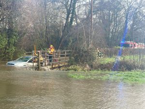 Supporting image for story: Warning not to drive through flood water after woman and dog rescued from submerged car near Oswestry