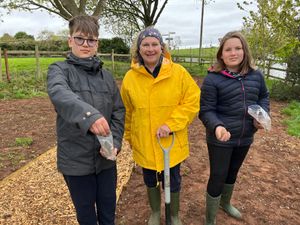 Youth club members Ted and Penny Pound joined Cllr Jill Hislop in the spreading of wildflower seeds.