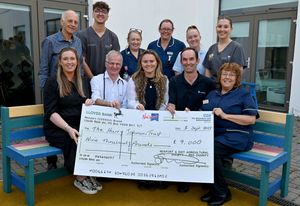 Dr Andrew Cowley, head for cancer services at Shrewsbury and Telford Hospitals NHS Trust (pictured second left) accepts a cheque for £9,000 on behalf of the Harry Johnson Trust after the money was raised by Newport and District Agricultural Society.