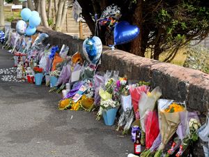 Supporting image for story: Tributes for three victims of a fatal road collision in Upper Gornal continue to grow as flowers and balloons are laid at the site of the crash