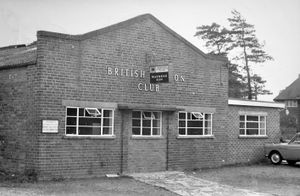 Circa 1960, the sign on the front of this building reads: 'British Legion (Market Drayton) Club Ltd. Watneys Ales.'
