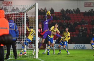 Kemar Roofe made his debut for Walsall after signing on a short-term deal on Friday.