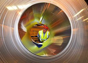 Shift manager Matthew Fryzer checks one of the aluminium coils