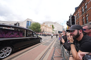 The hearse carrying the body of Ozzy Osbourne is seen near the Black Sabbath Bridge bench on Broad Street in Birmingham, as the Black Sabbath frontman's body is brought back to his home city for a procession following his death last week aged 76. Picture date: Wednesday July 30, 2025. PA Photo. Photo credit should read: Joe Giddens/PA Wire