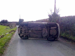 Supporting image for story: Pictures: 'Very lucky escape' as car overturns on road near Market Drayton