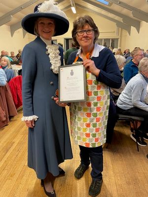 Coffee Club organiser Kay Egerton receives the certificate of appreciation from the High Sheriff (Diana Flint)