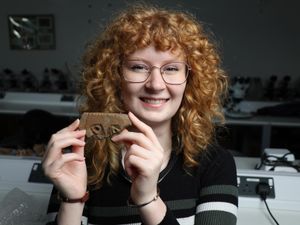 Supporting image for story: Archaeology student unearths rare stone carving that may show Pictish face