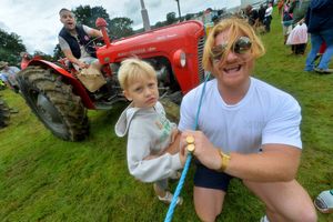 Leo Evans, 4, and Duncan Evans, with Tyler Evans on the tractor