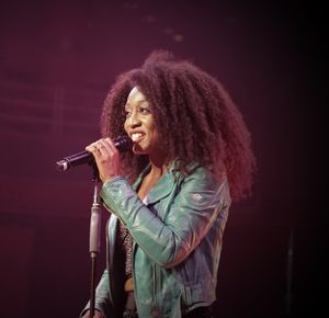 Beverley Knight performing on stage at Birmingham's Symphony Hall