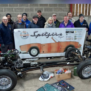 Karen Miller with the Shropshire Spitfire chassis and restoration team.