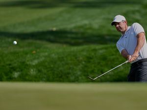 Rory McIlroy plays a chip shot at Sawgrass