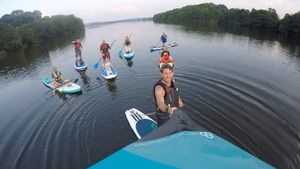 Club member Craig Jackson paddleboarding with friends