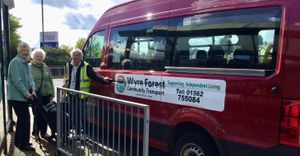 Volunteer WFCT driver Alan Wakefield welcomes passengers Elsie Farley and Marion Reynolds aboard