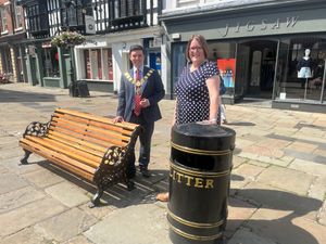 Mayor of Shrewsbury Alex Wagner, left, and Shrewsbury Town Council clerk Helen Ball take a look at one of the refurbished benches in The Square. Shrewsbury Men's Shed renovated the seating for the busy town centre spot, with funding from the town council, Shropshire Council and Shrewsbury BID