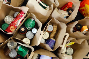 Food parcels were packed into paper bags to give out to families.
