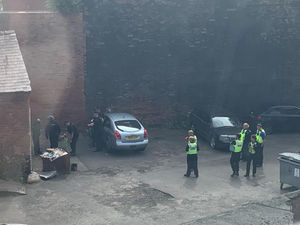 Police raiding the former mill off Albion Street in Wolverhampton