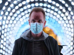 Supporting image for story: In Pictures: The Covid storm cloud that loomed large over 2021