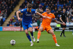 Tom Bloxham of Shrewsbury Town and Oliver Norburn of Blackpool (AMA)