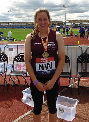 Hammer champion Katie Lambert is all smiles.