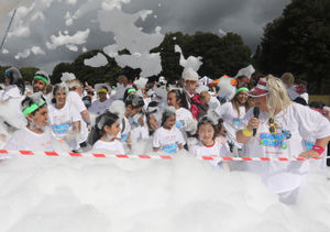 Enjoying the foam at the Acorns Bubble Rush.