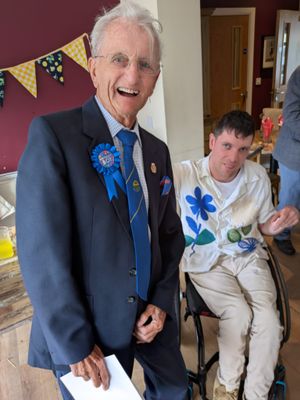 Ron enjoying his 100th Birthday Party with one of Home Matters Volunteer's Zac.
